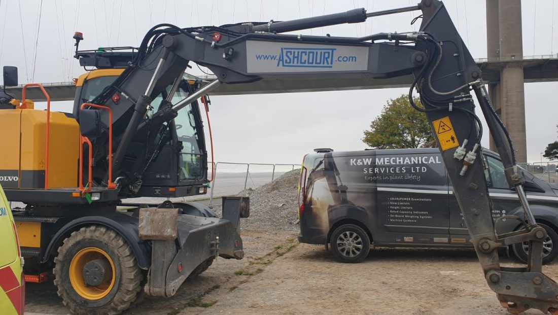 Humber Bridge as a backdrop for this Xwatch XW2 rated capacity indicator c/ w height limit on a Volvo EWR150e with TAB boom.