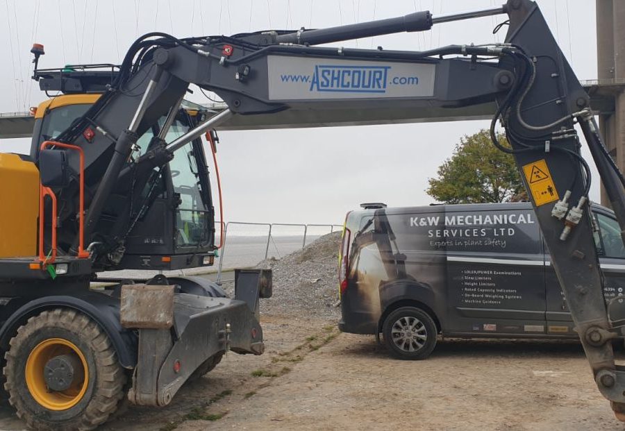 Humber Bridge as a backdrop for this Xwatch XW2 rated capacity indicator c/ w height limit on a Volvo EWR150e with TAB boom.