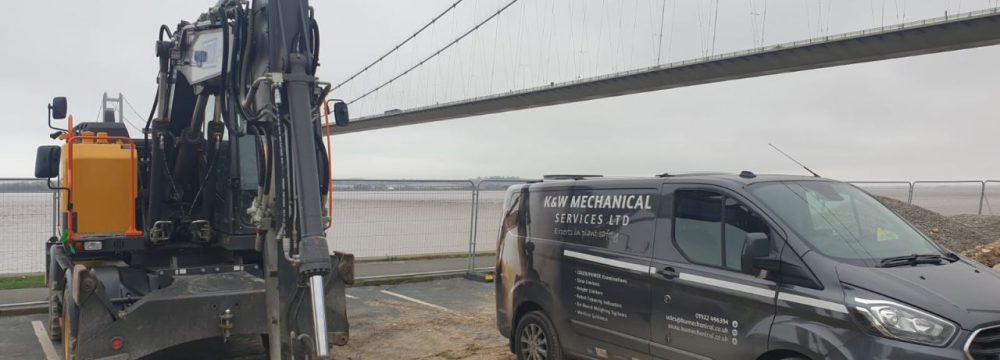 Humber Bridge as a backdrop for this Xwatch XW2 rated capacity indicator c/ w height limit on a Volvo EWR150e with TAB boom.
