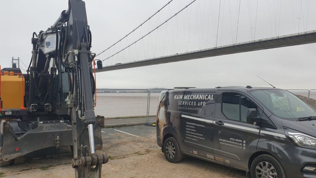 Humber Bridge as a backdrop for this Xwatch XW2 rated capacity indicator c/ w height limit on a Volvo EWR150e with TAB boom.