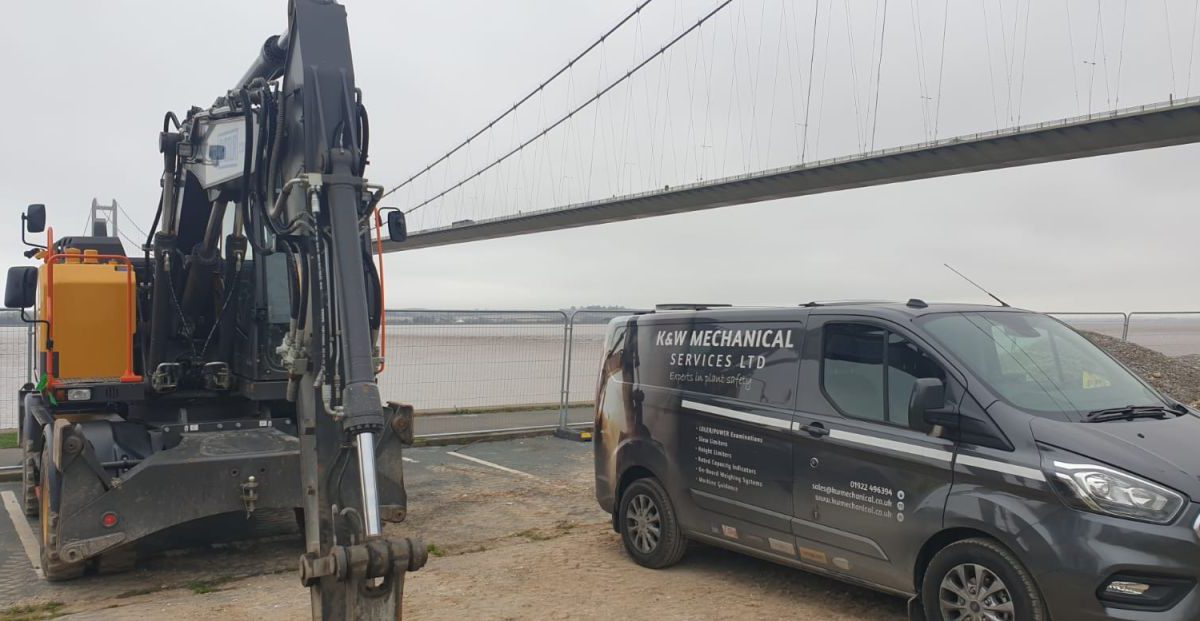 Humber Bridge as a backdrop for this Xwatch XW2 rated capacity indicator c/ w height limit on a Volvo EWR150e with TAB boom.