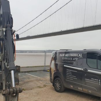 Humber Bridge as a backdrop for this Xwatch XW2 rated capacity indicator c/ w height limit on a Volvo EWR150e with TAB boom.