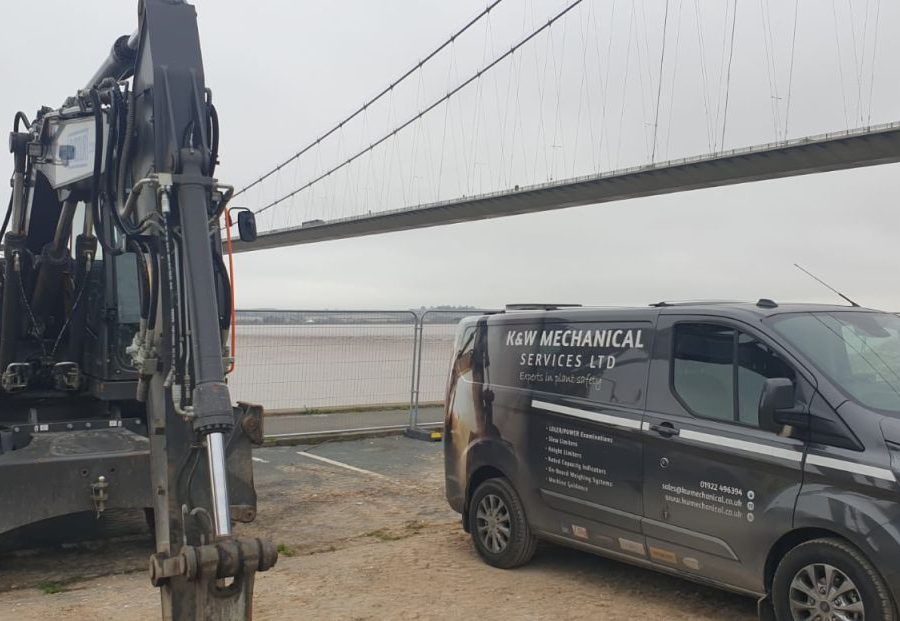 Humber Bridge as a backdrop for this Xwatch XW2 rated capacity indicator c/ w height limit on a Volvo EWR150e with TAB boom.