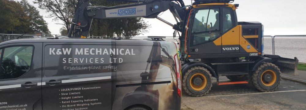 Humber Bridge as a backdrop for this Xwatch XW2 rated capacity indicator c/ w height limit on a Volvo EWR150e with TAB boom.
