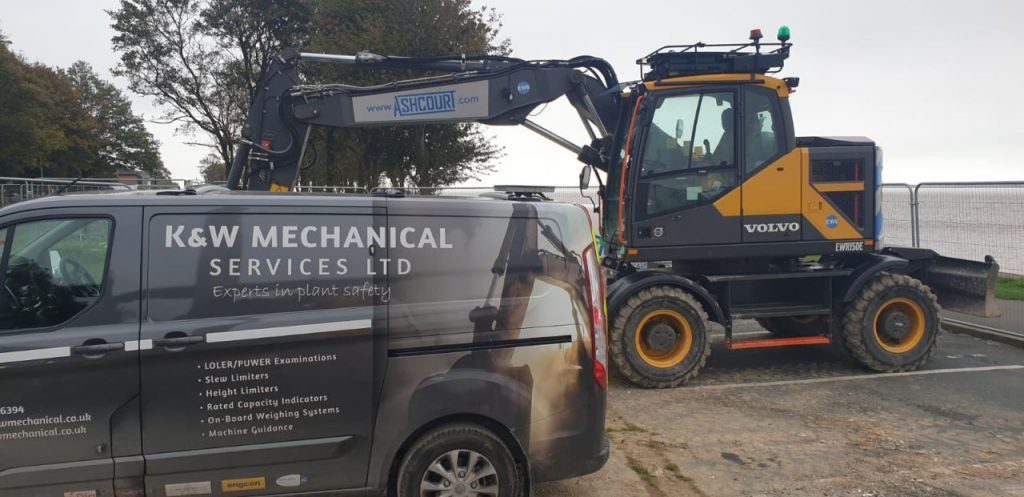 Humber Bridge as a backdrop for this Xwatch XW2 rated capacity indicator c/ w height limit on a Volvo EWR150e with TAB boom.