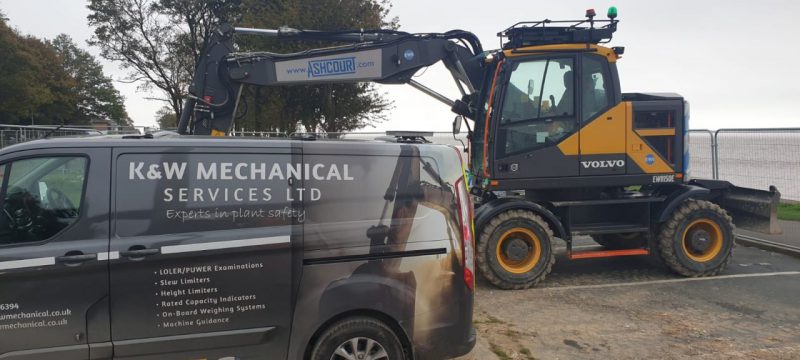 Humber Bridge as a backdrop for this Xwatch XW2 rated capacity indicator c/ w height limit on a Volvo EWR150e with TAB boom.