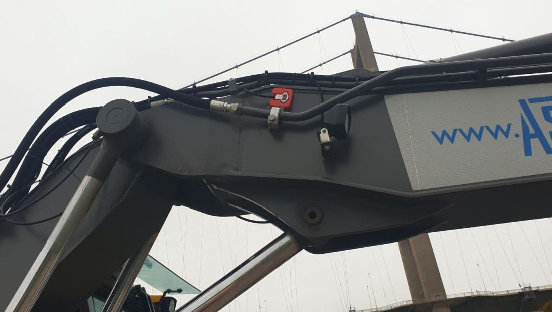 Humber Bridge as a backdrop for this Xwatch XW2 rated capacity indicator c/ w height limit on a Volvo EWR150e with TAB boom.